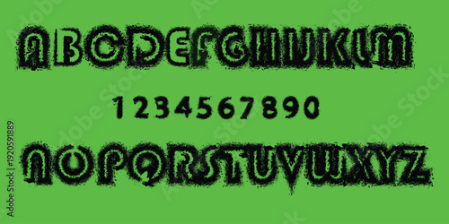 Alphabet and number display in black on green background