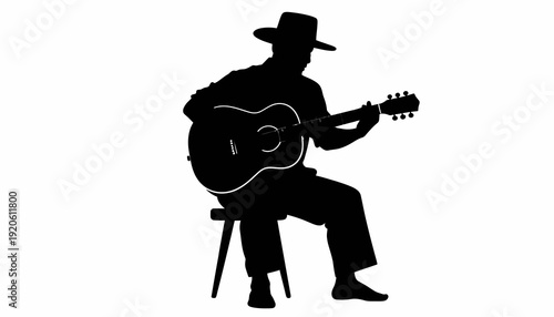 Silhouette of a man playing guitar while sitting on a stool.