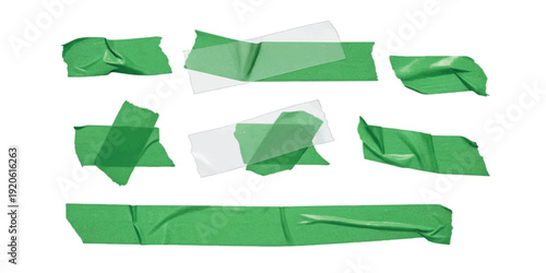 A collection of crumpled and torn pieces of green adhesive tape isolated on a white background