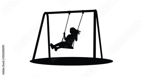 Silhouette of a child swinging on a swing set outdoors