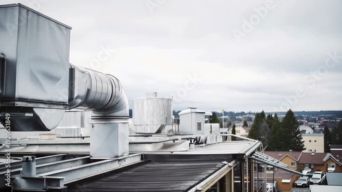 Medium shot side profile of an energy recovery ventilator with visible filter access panels and weatherproof louvers, robust mounting brackets, wind deflector 4K