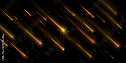 Abstract background of golden streaks and sparkling light trails on black