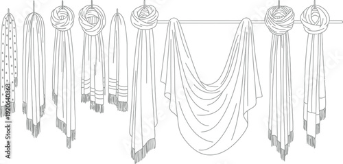 Collection of various stylish scarves and shawls draped and looped over a horizontal rod demonstrating different fashionable ways to hang textile accessories for display or storage purposes.