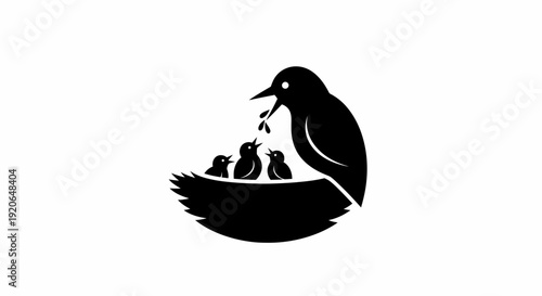 Mother bird feeding her chicks in the nest.