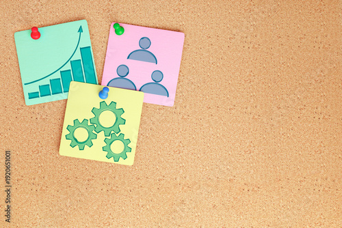 Colorful assortment of pinned sticky notes on cork board background. Organizational aids for reminders and tasks, perfect for office or educational use. Simple and effective method for notes