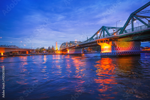 Memorial Bridge or Saphan Phut or Phut Bridge over the Chao Phraya River at sunset in Bangkok, Thailand