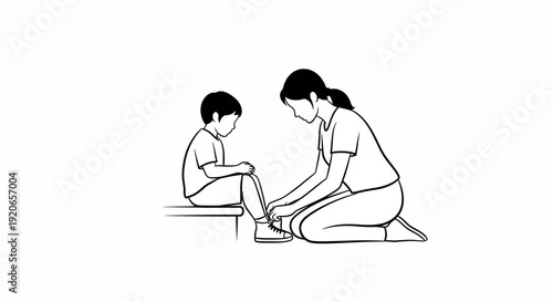 Mother assisting young son with putting on shoes.