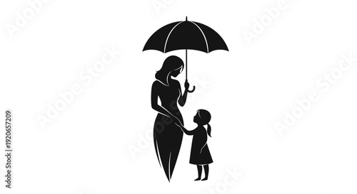 Mother and daughter standing together under an umbrella.
