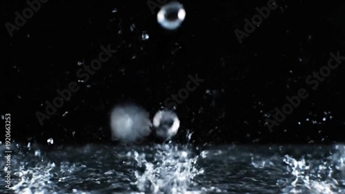 Water Droplets Splash in Mid Air Fluid Motion and Abstract Photography Concept in 4K
