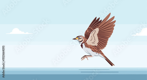 Graceful Meadowlark Bird Soaring Through a Clear Blue Sky