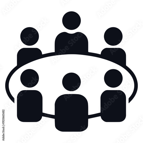 Group of people sitting around a table in a meeting