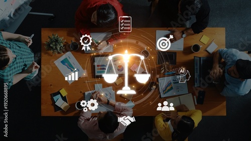 Canvas Print A dynamic business meeting in a modern office showcases teamwork with charts and symbols of innovation, justice, and goal setting, promoting collaboration and productivity