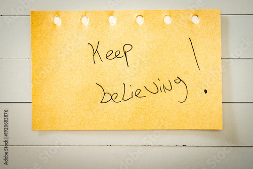 Canvas Print A handwritten note with Keep believing on it. Positive notes.