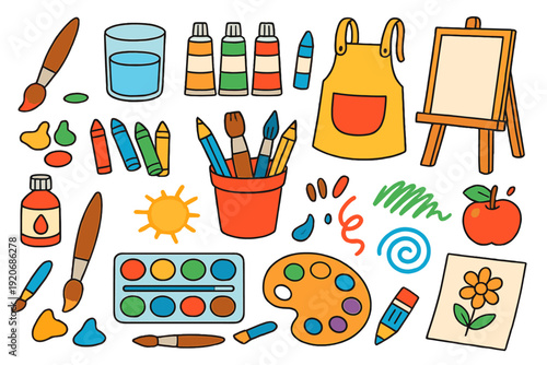 Art supplies and tools are arranged on a table for a creative project in an art studio or classroom setting