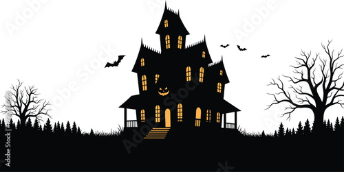 A spooky haunted house at dusk with bats flying around