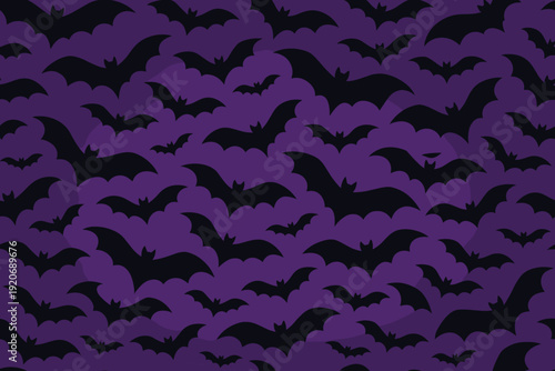 Bats flying in a night sky with a purple background during Halloween celebrations in October