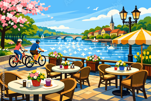 Bicyclists ride along a riverside path near a cafe with flowers and tables by the water on a sunny day in spring