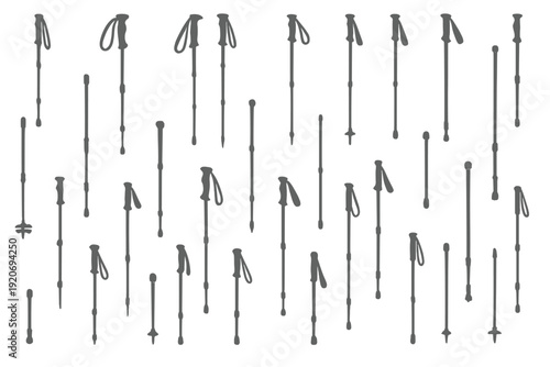 Many trekking poles arranged in a pattern on a white background for outdoor activities and hiking gear