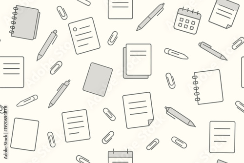 Office supplies spread across a surface with notebooks, pens, paper clips, and calendars during a workday