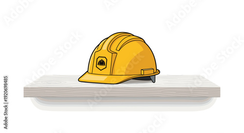 A yellow construction hard hat with a shield logo is resting on a light grey wooden shelf against a white background.