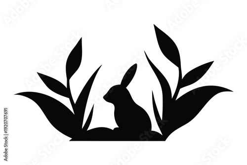 Easter Sunday silhouette blooming tree Black silhouette of a rabbit sitting among stylized tall grass leaves on white background