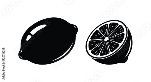 A whole lemon and a halved lemon in stark contrast silhouette