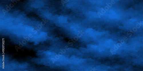 Dramatic dark storm clouds sweep across the overcast sky in an abstract nature cloudscape where fleeting light breaks through the heavy rainy air