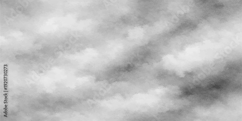 Dramatic dark storm clouds fill the overcast sky in a moody nature background of wind and rain