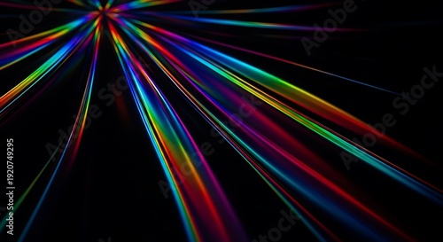 Vibrant multicolored light rays emanating from a central point against a dark background.