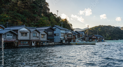 Beautiful late afternoon sight in Ine Bay, with the typical Funaya boat houses. Kyoto, Japan.