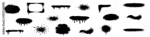 Set of black graffiti spray paint splatters and dripping ink stains isolated on white background.