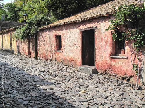 Red Historic House on a Cobblestone Street – Colonia del Sacramento