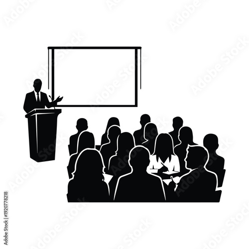 A speaker presents to an audience in a lecture hall setting