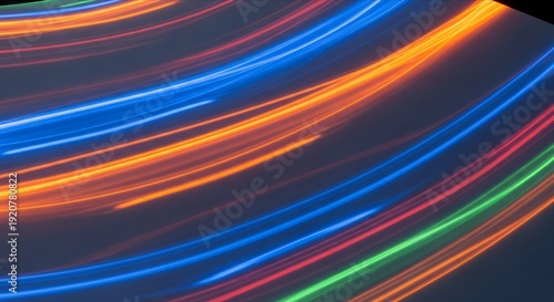Colorful Light Trails on Dark Background Creating Dynamic Motion Effect