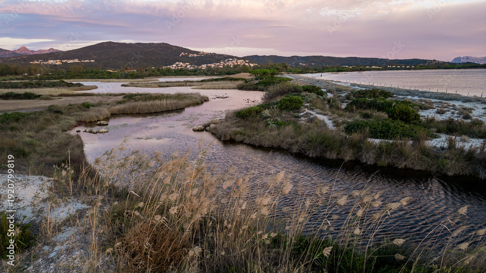 Obraz premium Aerial view of Baia Sant'Anna Pond at sunset, Budoni, Sardinia, Italy.