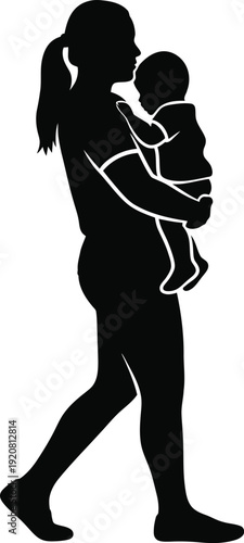 Silhouette of a woman holding a baby