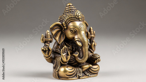 Bronze Ganesha Statue Sitting on Floor.