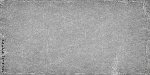 Aged black and white grunge paper texture with a dark rough concrete pattern and vintage grey stone surface design for a weathered material backdrop