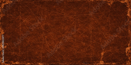 Antique aged parchment with a brown vintage grunge pattern and a rough textured surface creates a dark blank material backdrop for an ancient paper texture background