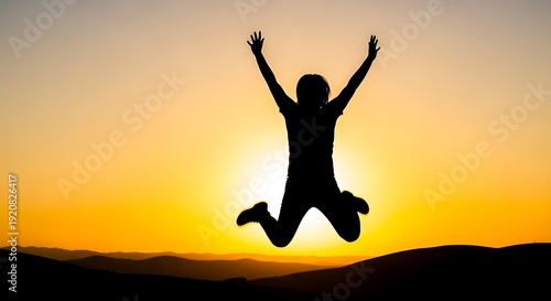 Wallpaper Mural Silhouette of a person mid-air with arms raised against a sunset backdrop (1) Torontodigital.ca