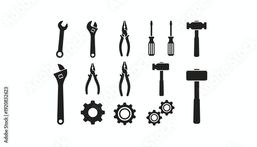 Collection of various black silhouetted tools and mechanical parts.