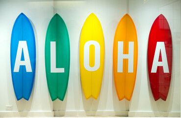 USA, Hawaii, Honolulu, Waikiki.  Surfboards with letters spelling out aloha.  Store window display.