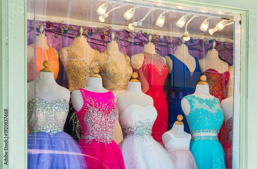 USA, Hawaii, Oahu, Honolulu.  Fancy prom dresses displayed in shop window.