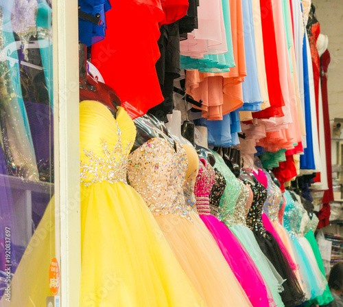 USA, Hawaii, Oahu, Honolulu.  Fancy prom dresses displayed in shop window.