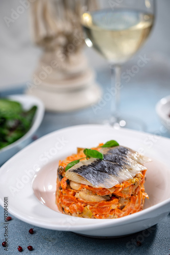 Billede på lærred Layered herring salad with wine pairing