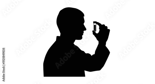 Silhouette of a person holding a small vial to inspect it closely, representing scientific research or pharmaceutical development