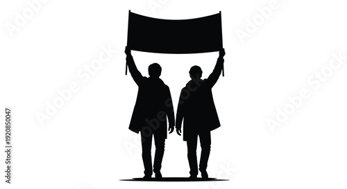Two people holding a banner together striking a powerful silhouette