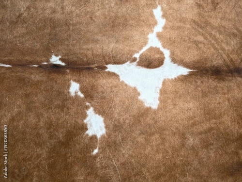 Brown cowhide rug. Authentic rustic cowhide featuring natural spots and warm soft feel for interior styling