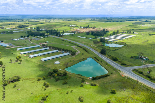 Drone aerial photograph of large farmland pastures and buildings in the greater Sydney town of Luddenham in New South Wales, Australia.