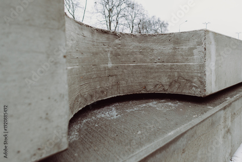 Prefabricated concrete element with curved structural cutout designed for infrastructure systems. Precision-engineered precast slab prepared for installation.